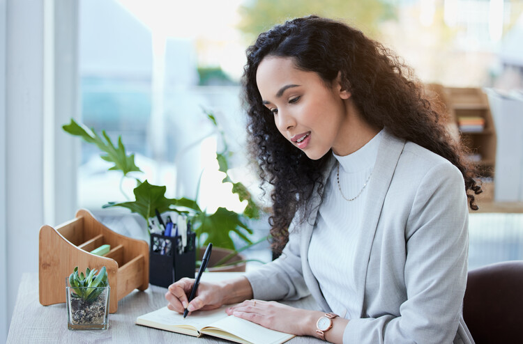 professional woman writting notes